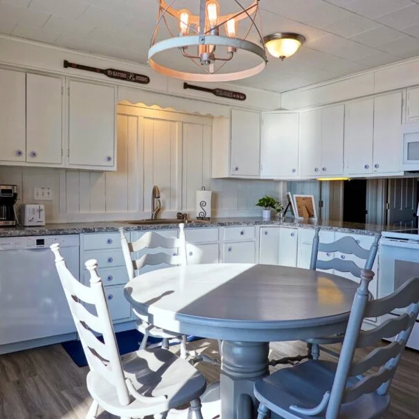 Cozy mornings, fresh coffee, and breathtaking lake panoramas. Start your day in Cabin 1's kitchen at Sunset Shore Mille Lacs.