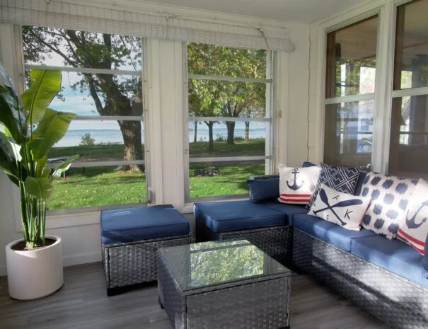 Sun-kissed serenity awaits in Cabin 1's lakeside haven. Lush greenery & endless blue stretch before you.