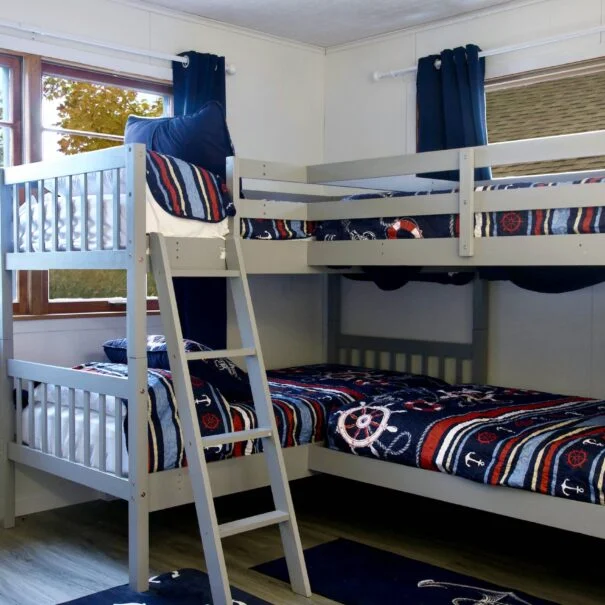 The second bedroom in Cabin 1 at Sunset Shore Mille Lacs features two twin bunk beds (four total beds), making it the perfect space for families or groups of friends.